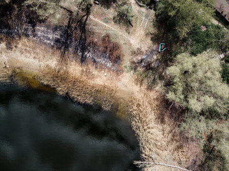 landscape with water from above. Aerial view of sandy beach and ocean with waves. Photo taken by a...