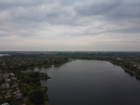 landscape with water from above. Aerial view of sandy beach and ocean with waves. Photo taken by a drone from above. natural landscape. Aerial view of a green grassy forest.の写真素材