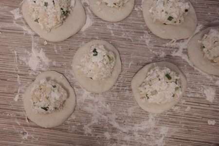 making cakes. cakes with cheese. dough. bread with cheese. cooking bread.Fried quesadillas with...