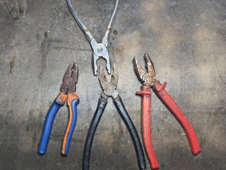 old pliers. rusty pair of pliers, detailed view showing the texture of the rust and wear on the tool, ideal for visual contexts related to aging.の写真素材