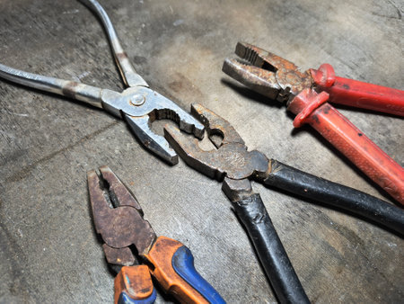 old pliers. rusty pair of pliers, detailed view showing the texture of the rust and wear on the tool, ideal for visual contexts related to aging.の写真素材