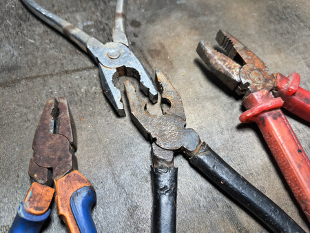 old pliers. rusty pair of pliers, detailed view showing the texture of the rust and wear on the tool, ideal for visual contexts related to aging.の写真素材