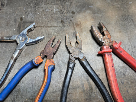 old pliers. rusty pair of pliers, detailed view showing the texture of the rust and wear on the tool, ideal for visual contexts related to aging.の写真素材