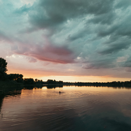 very beautiful sunset with water. summer evening landscape with reflection of clouds in water....