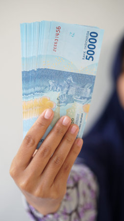 Yogyakarta, Indonesia - August 28, 2020: Indonesian rupiah currency, around 50,000 Indonesian money,...
