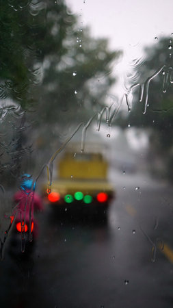 Raindrops on the windshield of the car. Focus selected. Blur backgroundの写真素材