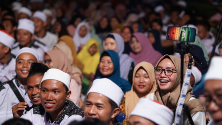 Pemalang, Indonesia. July 12, 2019. Muslims at a religious event. Focus is selected on smiling Muslim womenのeditorial素材