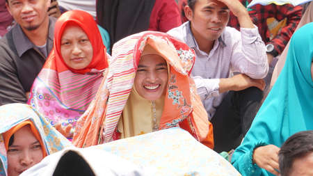 Wonosobo, INDONESIA. October 10, 2019: Muslim women smile at a religious event. Focus selectedのeditorial素材
