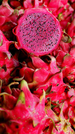 Dragon fruit slices. Looks fresh, black seeds are clearly visible. Focus selectedの写真素材
