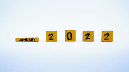 Wooden block calendar for January 2022. Yellow on a white background. Focus selectedの写真素材