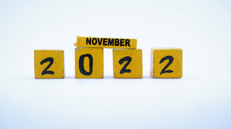 Wooden block calendar for November 2022. Yellow on a white background. Focus selectedの写真素材