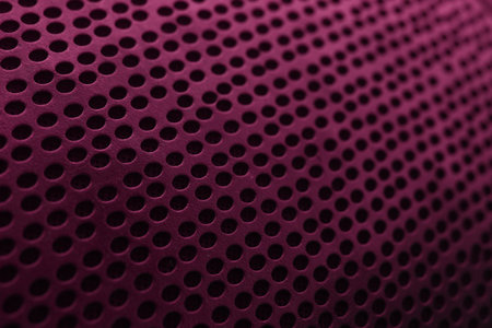 Speaker grill texture, pink and black. Great background for advertising and designの写真素材
