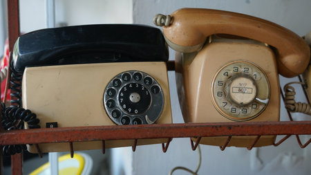 Brown vintage old phone. Focus selected. Blurred backgroundの写真素材