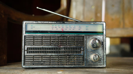 Old radio on a wooden chair. Focus selected. Blurred backgroundの写真素材
