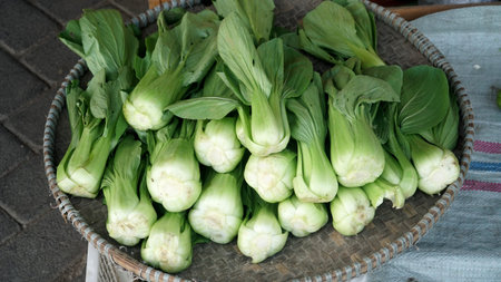 Mustard greens or pakcoy in bamboo basket. Focus selectedの写真素材