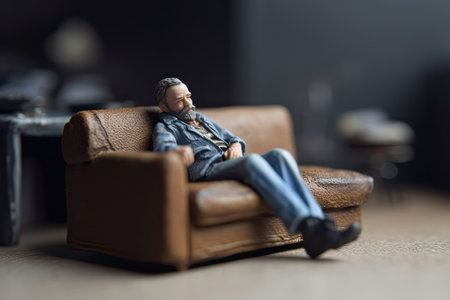 Thoughtful man sitting armchair in miniature style. Comfortable seat. Concept of convenience created with Generative AI Technologyの写真素材