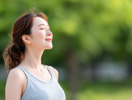 Girl enjoying deep breath in lush forest. Serene outdoor scene with green trees and tranquil vibe.の素材
