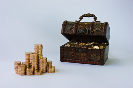 Little chest filled with small, copper coins.