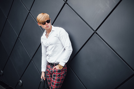 Stylish man on the street near the buildingの写真素材