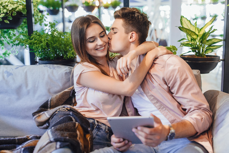 beautiful couple on the summer terraceの写真素材