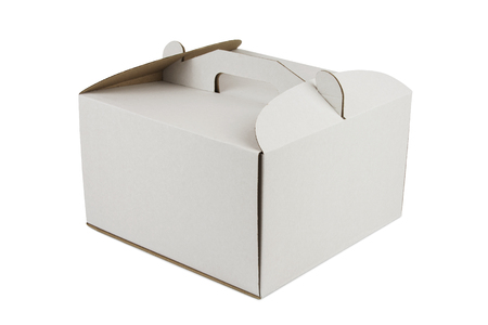 Cardboard box with handle for cake isolated on white background, shadow below.の写真素材