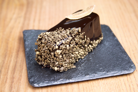 Chocolate cake with gold decor crumb.の写真素材