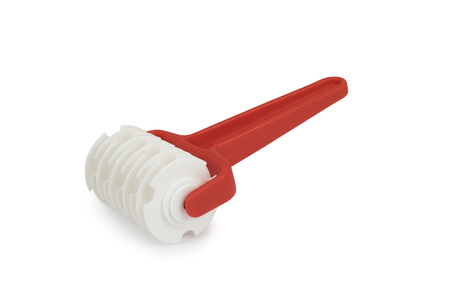 Confectionery knife for cutting dough isolated on white background shadow below.の写真素材