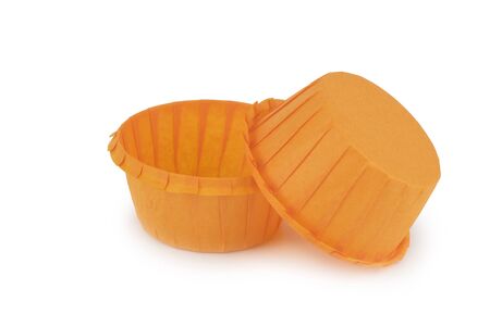 Muffin paper molds orange. Isolation on a white background, shadow below.の写真素材