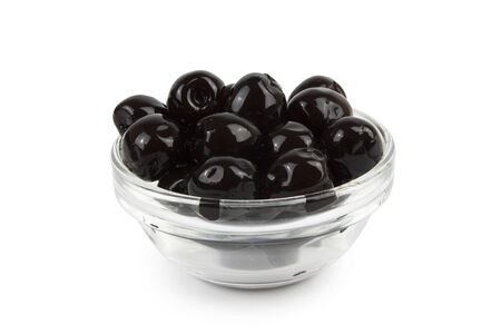 Black olives in a glass saucer. Isolation on a white background, shadow below.の写真素材
