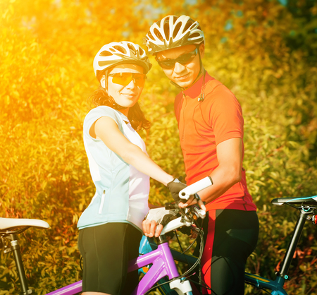 happy couple on bicyclesの写真素材