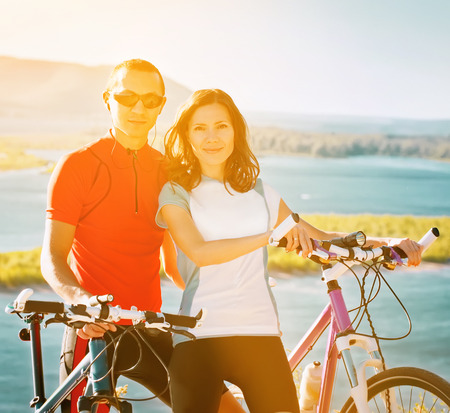 happy couple on bicyclesの写真素材