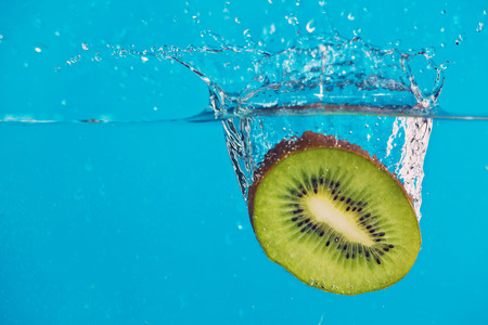 kiwi with splashの写真素材