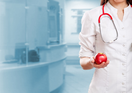 doctor holding appleの写真素材