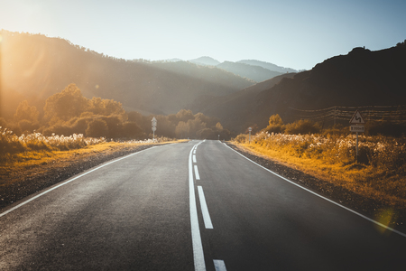 road in mountains. sunset.の写真素材