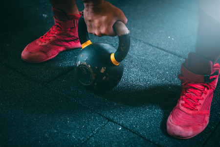 Kettle bell training in a gymnasium for fitnessの写真素材