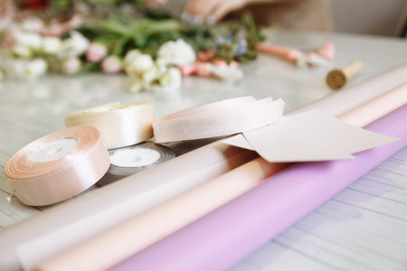 delicate ribbons and packages for forming bouquets are in the flower shop