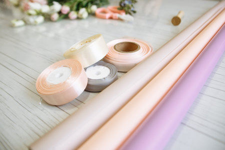 delicate ribbons and packages for forming bouquets are in the flower shop