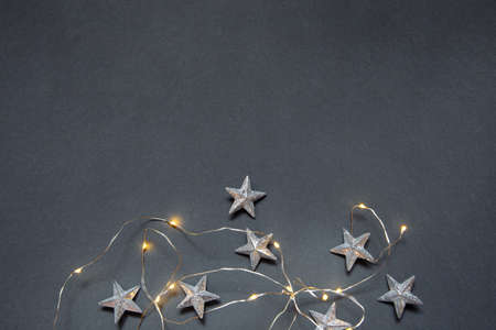 New Years gray photophone with Christmas garland and starsの写真素材