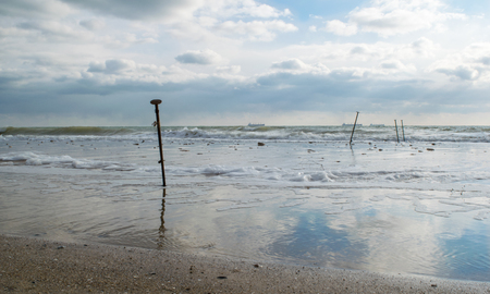 beautiful low tide on the coast of the sea in late autumnの写真素材
