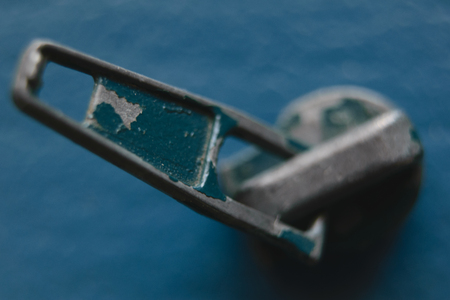 with the remnants of the old paint slider on a blue matte background closeupの写真素材