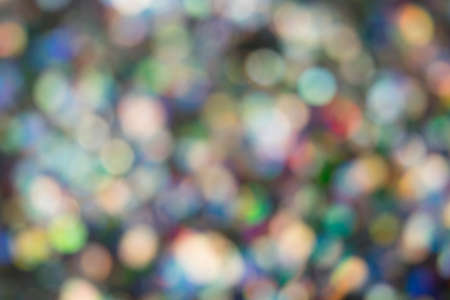 Bright festive colorful background of small lightsの写真素材