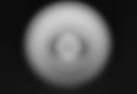 black background with a large white spot in the middle