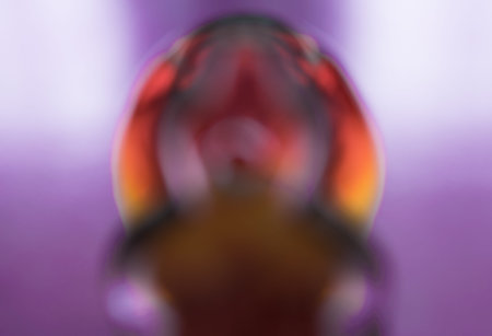 Abstract blurred pattern with an oval fire midpoint on a purple backgroundの写真素材