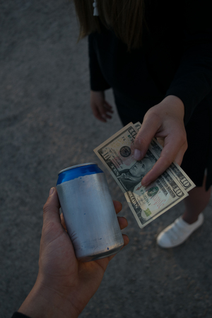 A near sad future, where clean air is sold for money, two hands making a deal to sell jars of airの写真素材