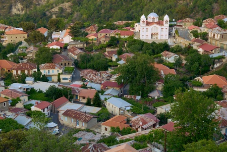 Lots of houses and church in small town in mountain viewed from above, Cyprus の写真素材