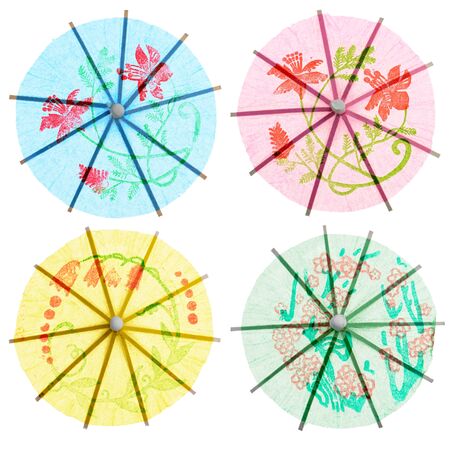 A four paper drink umbrellas isolated on white backgroundの写真素材