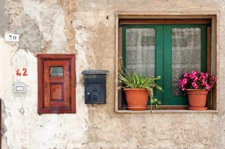 Photo of wall with window and mailbox  Photo taken in Cilento area, Campania, Italy の写真素材