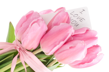 Tulips bouquet with 'i love you' note isolated on white.の写真素材