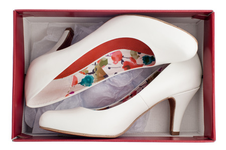 Women's white high heels shoes in box isolated の写真素材