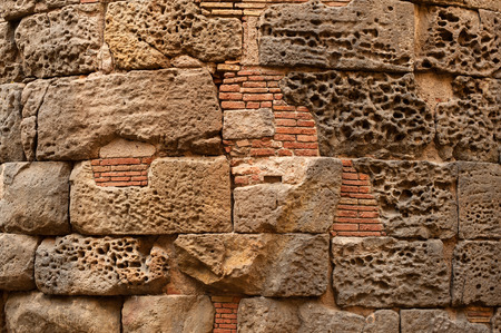 Stone wall texture with bricksの写真素材